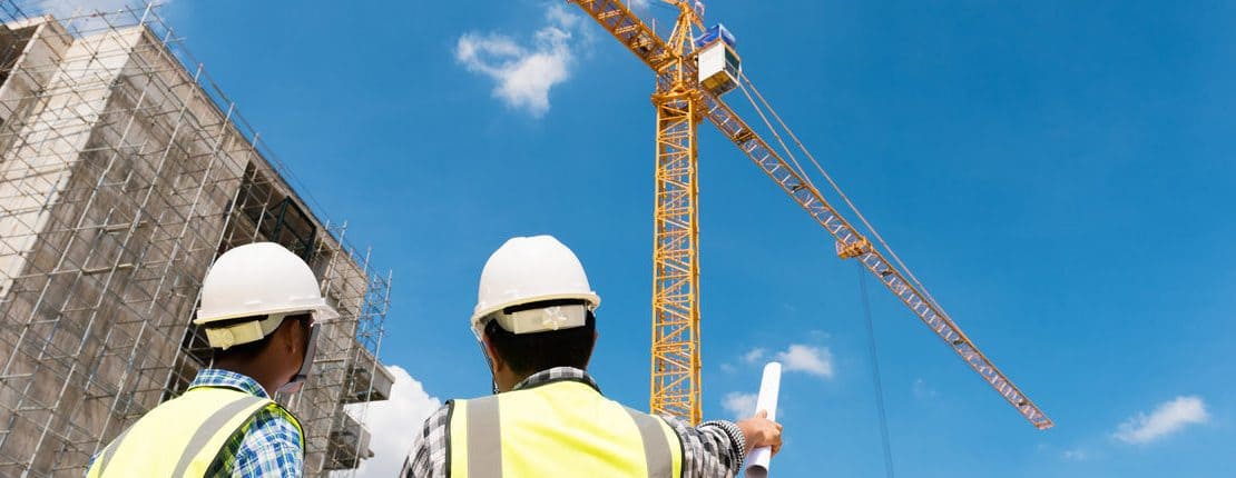 Engineers with blueprint